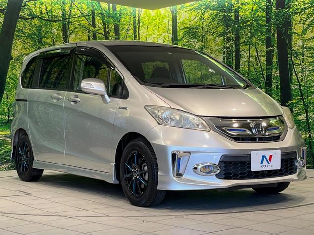 フリードハイブリッド ジャストセレクション　純正９型ナビ　後席モニター　バックカメラ　両側電動ドア　禁煙車　クルコン　ハーフレザーシート　スマートキー　ＨＩＤヘッド　ビルトインＥＴＣ　オートライト　オートエアコン　ＣＤ／ＤＶＤ再生　地デジ（17枚目）