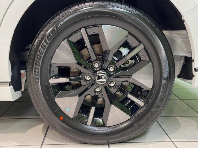 ステップワゴン ｅ：ＨＥＶスパーダ　登録済未使用車　ホンダセンシング　アダプティブクルーズ　両側電動スライドドア　純正１１型ナビ　バックカメラ　フルセグ　Ｂｌｕｅｔｏｏｔｈ　電動リアゲート　禁煙車　ＬＥＤヘッド／フォグ　スマートキー（50枚目）