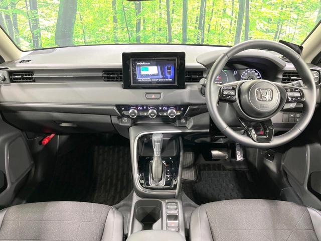 ヴェゼル ｅ：ＨＥＶ　Ｚ　ホンダセンシング　禁煙車　アダプティブコントロール　電動リアゲート　寒冷地仕様　ディスプレイオーディオ　バックカメラ　Ｂｌｕｅｔｏｏｔｈ　ＥＴＣ　シートヒーター　ＬＥＤヘッド　デュアルエアコン（2枚目）