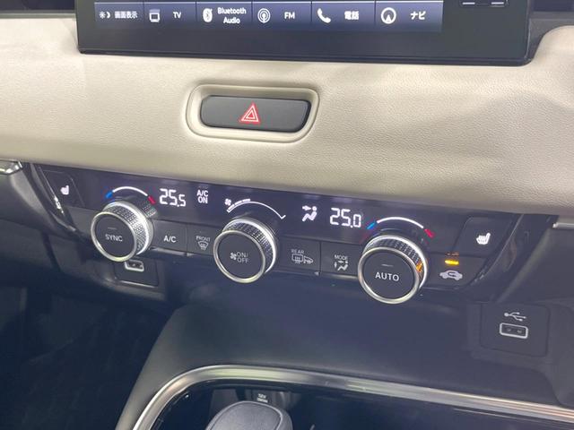 ヴェゼル ｅ：ＨＥＶ　Ｚ　純正９インチナビ　ホンダセンシング　全周囲カメラ　アダプティブクルーズコントロール　ＢＳＭ　電動リアゲート　置くだけ充電　寒冷地仕様　Ｂｌｕｅｔｏｏｔｈ　ＥＴＣ　シートヒーター　ＬＥＤヘッドライト（63枚目）