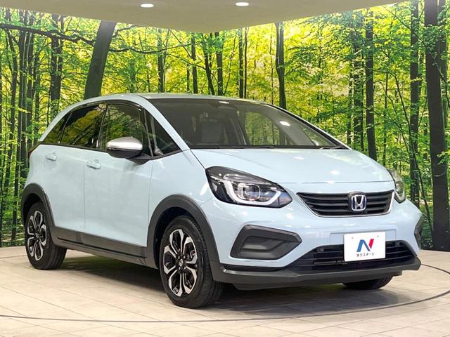 フィット ｅ：ＨＥＶクロスター　純正９型ナビ　バックカメラ　衝突被害軽減システム　ＥＴＣ　レーダークルーズ　禁煙車　ドラレコ　コーナーセンサー　スマートキー　ＬＥＤヘッド　オートハイビーム　車線逸脱警報　フルセグ　プライバシーガラス（16枚目）