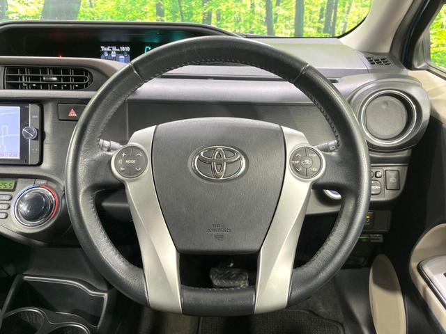 アクア Ｇ　純正ナビ　禁煙車　バックカメラ　ＥＴＣ　フルセグ　Ｂｌｕｅｔｏｏｔｈ　スマートキー　オートライト　ステアリングスイッチ　オートエアコン　盗難防止装置　プライバシーガラス　アイドリングストップ　横滑防止（11枚目）