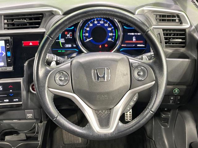 フィットハイブリッド Ｓパッケージ　純正ＳＤナビ　バックカメラ　寒冷地仕様　衝突被害軽減システム　禁煙車　ドラレコ　スマートキー　ＬＥＤヘッド　ＥＴＣ　クルコン　純正１６インチアルミ　オートライト　オートエアコン　Ｂｌｕｅｔｏｏｔｈ（11枚目）