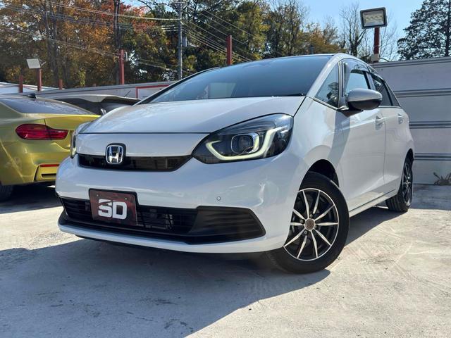 フィット ｅ：ＨＥＶベーシック　ドライブレコーダー　ＥＴＣ　バックカメラ　ナビ　クリアランスソナー　オートクルーズコントロール　レーンアシスト　衝突被害軽減システム　アルミホイール　オートライト　ＬＥＤヘッドランプ　スマートキー（2枚目）