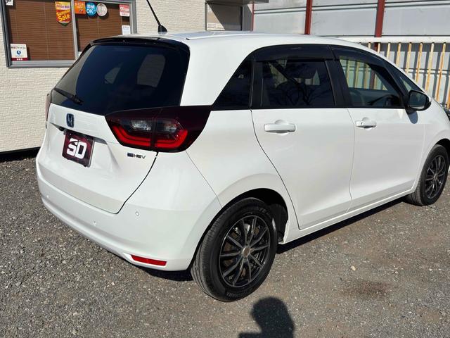 フィット ｅ：ＨＥＶベーシック　ドライブレコーダー　ＥＴＣ　バックカメラ　ナビ　クリアランスソナー　オートクルーズコントロール　レーンアシスト　衝突被害軽減システム　アルミホイール　オートライト　ＬＥＤヘッドランプ　スマートキー（6枚目）