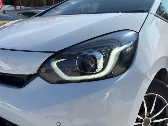 フィット ｅ：ＨＥＶベーシック　ドライブレコーダー　ＥＴＣ　バックカメラ　ナビ　クリアランスソナー　オートクルーズコントロール　レーンアシスト　衝突被害軽減システム　アルミホイール　オートライト　ＬＥＤヘッドランプ　スマートキー（16枚目）