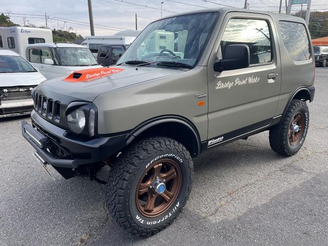 ジムニー ワイルドウインド 社外ナビ バックカメラ 色替え 2.5インチアップ 社外マフラー 社外ステアリング ETC(3枚目)