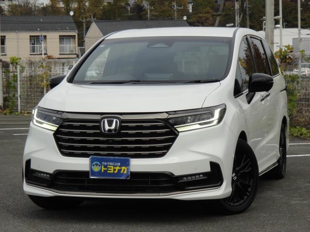 オデッセイハイブリッド ｅ：ＨＥＶアブソルート・ＥＸブラックエディション　純正１１．４インチコネクトナビＤＴＶ　純正１５．６インチ後席モニター　マルチビューカメラ　ブラックレザーシート　１・２列シートヒーター　２列目両側アームレスト付４ウェイパワーシート　ディーラーデモカー（2枚目）