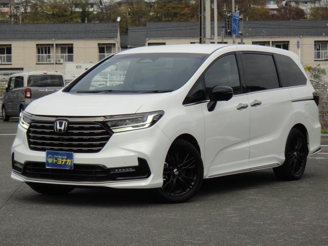 オデッセイハイブリッド ｅ：ＨＥＶアブソルート・ＥＸブラックエディション　純正１１．４インチコネクトナビＤＴＶ　純正１５．６インチ後席モニター　マルチビューカメラ　ブラックレザーシート　１・２列シートヒーター　２列目両側アームレスト付４ウェイパワーシート　ディーラーデモカー（3枚目）