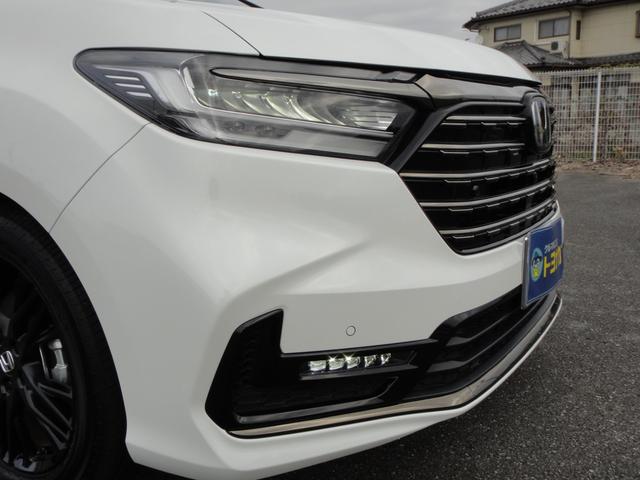 オデッセイハイブリッド ｅ：ＨＥＶアブソルート・ＥＸブラックエディション　純正１１．４インチコネクトナビＤＴＶ　純正１５．６インチ後席モニター　マルチビューカメラ　ブラックレザーシート　１・２列シートヒーター　２列目両側アームレスト付４ウェイパワーシート　ディーラーデモカー（7枚目）