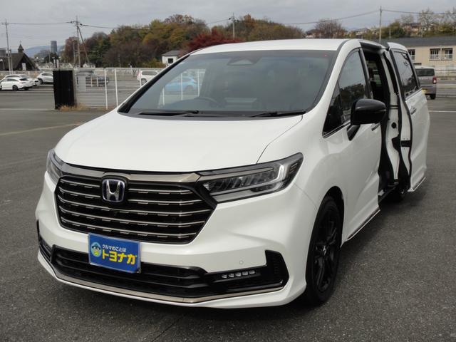 オデッセイハイブリッド ｅ：ＨＥＶアブソルート・ＥＸブラックエディション　純正１１．４インチコネクトナビＤＴＶ　純正１５．６インチ後席モニター　マルチビューカメラ　ブラックレザーシート　１・２列シートヒーター　２列目両側アームレスト付４ウェイパワーシート　ディーラーデモカー（11枚目）