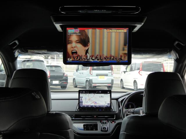 オデッセイハイブリッド ｅ：ＨＥＶアブソルート・ＥＸブラックエディション　純正１１．４インチコネクトナビＤＴＶ　純正１５．６インチ後席モニター　マルチビューカメラ　ブラックレザーシート　１・２列シートヒーター　２列目両側アームレスト付４ウェイパワーシート　ディーラーデモカー（22枚目）