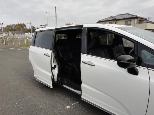 オデッセイハイブリッド ｅ：ＨＥＶアブソルート・ＥＸブラックエディション　純正１１．４インチコネクトナビＤＴＶ　純正１５．６インチ後席モニター　マルチビューカメラ　ブラックレザーシート　１・２列シートヒーター　２列目両側アームレスト付４ウェイパワーシート　ディーラーデモカー（36枚目）