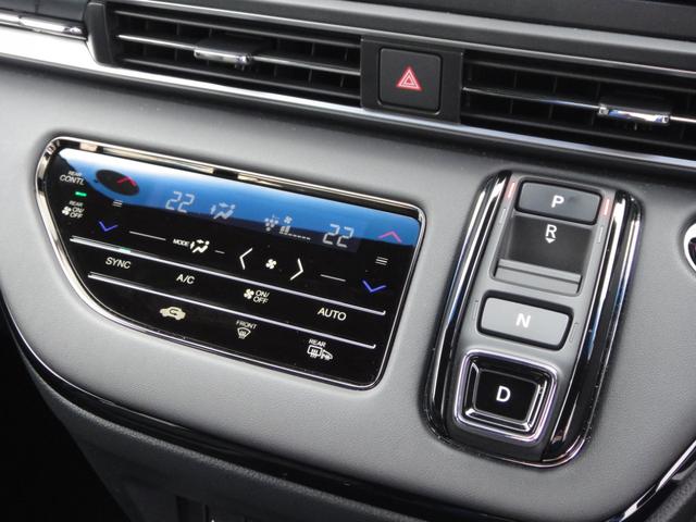 オデッセイハイブリッド ｅ：ＨＥＶアブソルート・ＥＸブラックエディション　純正１１．４インチコネクトナビＤＴＶ　純正１５．６インチ後席モニター　マルチビューカメラ　ブラックレザーシート　１・２列シートヒーター　２列目両側アームレスト付４ウェイパワーシート　ディーラーデモカー（42枚目）