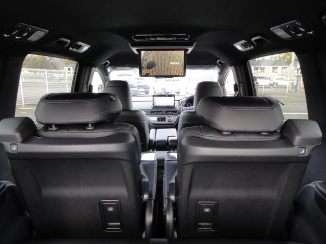 オデッセイハイブリッド ｅ：ＨＥＶアブソルート・ＥＸブラックエディション　純正１１．４インチコネクトナビＤＴＶ　純正１５．６インチ後席モニター　マルチビューカメラ　ブラックレザーシート　１・２列シートヒーター　２列目両側アームレスト付４ウェイパワーシート　ディーラーデモカー（76枚目）