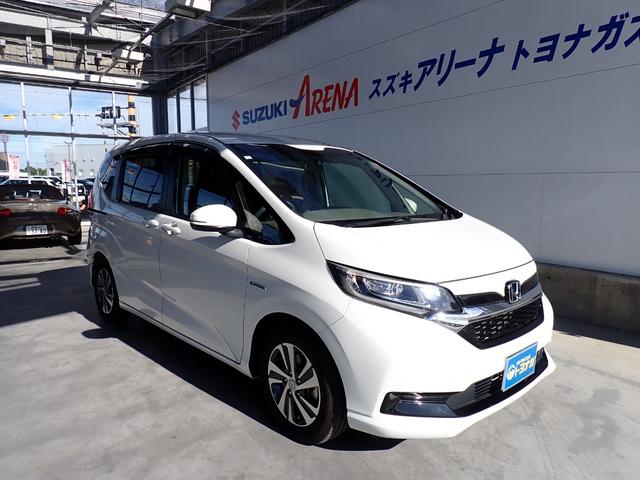 フリード+ハイブリッド ハイブリッドG・ホンダセンシング Cパッケージ 9インチプレミアムインターナビ フルセグTV バックカメラ ビルトインETC ナビ連動前後ドライブレコーダー シートヒーター 両側パワースライドドア LEDヘッドランプ(3枚目)