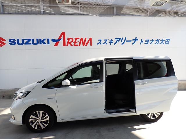 フリード+ハイブリッド ハイブリッドG・ホンダセンシング Cパッケージ 9インチプレミアムインターナビ フルセグTV バックカメラ ビルトインETC ナビ連動前後ドライブレコーダー シートヒーター 両側パワースライドドア LEDヘッドランプ(7枚目)