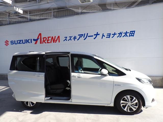 フリード+ハイブリッド ハイブリッドG・ホンダセンシング Cパッケージ 9インチプレミアムインターナビ フルセグTV バックカメラ ビルトインETC ナビ連動前後ドライブレコーダー シートヒーター 両側パワースライドドア LEDヘッドランプ(8枚目)