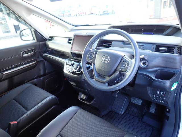 フリード+ハイブリッド ハイブリッドG・ホンダセンシング Cパッケージ 9インチプレミアムインターナビ フルセグTV バックカメラ ビルトインETC ナビ連動前後ドライブレコーダー シートヒーター 両側パワースライドドア LEDヘッドランプ(10枚目)