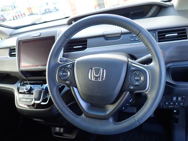 フリード+ハイブリッド ハイブリッドG・ホンダセンシング Cパッケージ 9インチプレミアムインターナビ フルセグTV バックカメラ ビルトインETC ナビ連動前後ドライブレコーダー シートヒーター 両側パワースライドドア LEDヘッドランプ(14枚目)