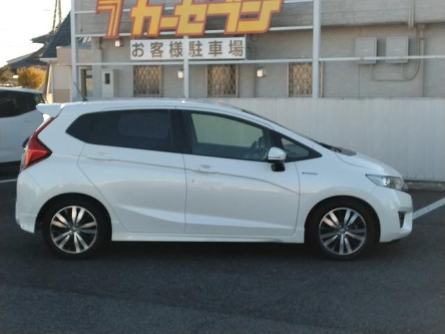 フィットハイブリッド Sパッケージ LEDヘットライト メモリナビ DVD再生 BTオーディオ ワンセグテレビ ナビTV リアカメラ クルコン Wエアバック Dレコ ETC付 イモビライザー オートライト 衝突安全ボディ 電動格納ミラー(4枚目)