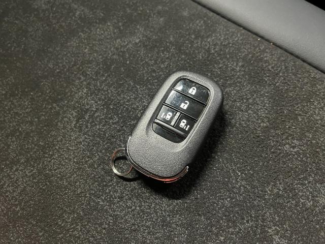 N-BOXカスタム ターボ カスタムターボ_両側パワースライドドア_シートヒーター_ハーフレザー ステアリングスイッチ スマートキー 電動格納ミラー 純正アルミホイール ベンチシート シートバックテーブル LEDヘッドライト(26枚目)