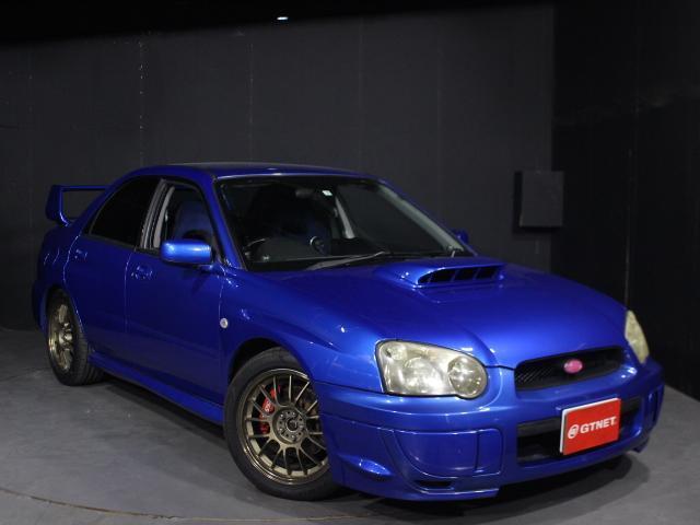 ＷＲＸ　２００４　Ｖリミテッド　ストラーダＨＤＤナビ　バックカメラ　ＥＴＣ　ＭＯＭＯステアリング　テイン車高調フレックスＺ　レイズボルクレーシングＳＥ３７Ｋ１７ＡＷ　ＨＫＳエアクリ　ブリッツラジエーター　ＳＴＩゲノムマフラー(3枚目)