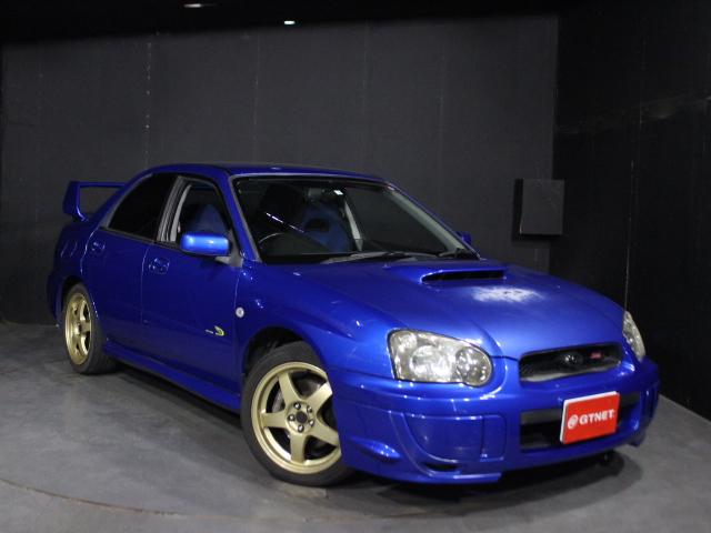 インプレッサ ＷＲＸ　２００３　Ｖリミテッド　純正レイズ鍛造１７ＡＷ　ＳＴＩゲノムフロントタワーバー　ゼロスポーツマフラー　ＫＵＲＴＵディスプレイオーディオ　ＥＴＣ　ＨＩＤ　ＭＯＭＯステアリング　タイミング交換済　大型リアスポイラー（3枚目）