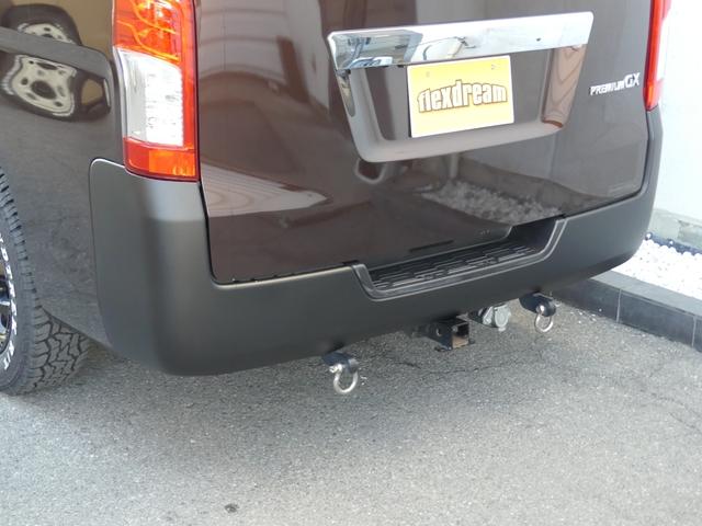 NV350キャラバンバン ロングプレミアムGXターボ 新作丸目フェイスキット アルパイン製11インチナビ 片側ワンタッチオートスライドドア 跳ね上げ式ベッドキット 有料色:インペリアルアンバー アルミホイール&タイヤセット エマージェンシーブレーキ(15枚目)