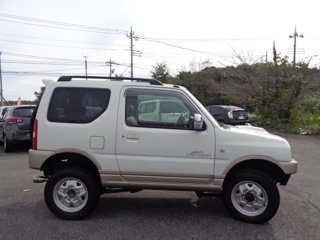 ジムニー ランドベンチャー ターボ パートタイム4WD 前後バンパー 背面タイヤ 16インチ リフトアップ マフラー HIDライト キーレス メモリーナビ DVD再生 CD ワンセグTV ハーフレザー 走行6.1万 取説記録簿(5枚目)