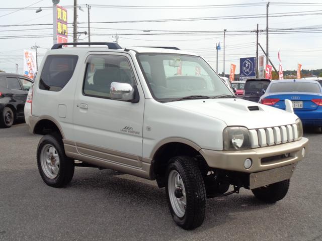 ジムニー ランドベンチャー ターボ パートタイム4WD 前後バンパー 背面タイヤ 16インチ リフトアップ マフラー HIDライト キーレス メモリーナビ DVD再生 CD ワンセグTV ハーフレザー 走行6.1万 取説記録簿(8枚目)