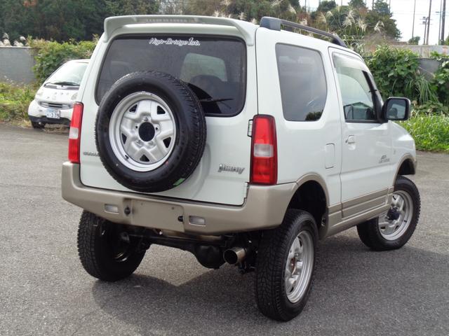 ジムニー ランドベンチャー ターボ パートタイム4WD 前後バンパー 背面タイヤ 16インチ リフトアップ マフラー HIDライト キーレス メモリーナビ DVD再生 CD ワンセグTV ハーフレザー 走行6.1万 取説記録簿(9枚目)