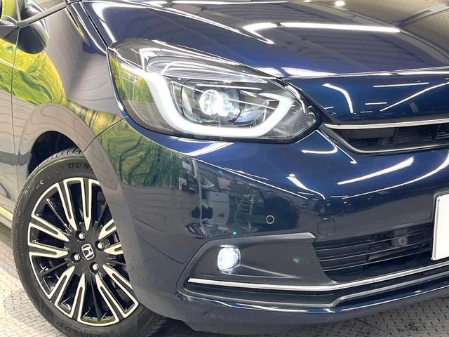 フィット ｅ：ＨＥＶリュクス　全周囲カメラ　衝突被害軽減システム　レーダークルーズ　禁煙車　レザーシート　コーナーセンサー　スマートキー　ＬＥＤヘッド　ＥＴＣ２．０　オートハイビーム　車線逸脱警報　オートライト　オートエアコン（12枚目）