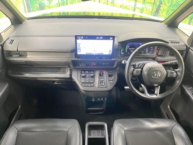 ステップワゴン e:HEVスパーダ 両側電動スライドドア 純正11.4型ナビ 全周囲カメラ 衝突被害軽減システム アダプティブクルーズ 禁煙車 ハーフレザーシート シートヒーター LEDヘッド LEDフォグ ETC オートハイビーム(2枚目)