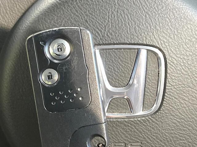 ゼスト D 純正DVDナビ 禁煙車 スマートキー オートエアコン CD 電動格納ミラー 盗難防止システム 衝突安全ボディー ドアバイザー ベンチシート パワーウィンドウ(5枚目)