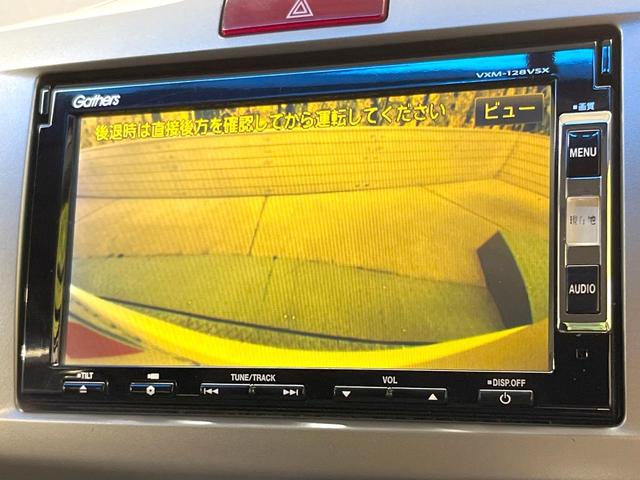 フリード Ｇ　ジャストセレクション　純正ナビ　電動スライドドア　バックカメラ　禁煙車　スマートキー　ＥＴＣ　オートエアコン　ＣＤ　ＤＶＤ再生　地デジ　電動格納ミラー　横滑り防止　プライバシーガラス　パワーウィンドウ　パワーステアリング（5枚目）