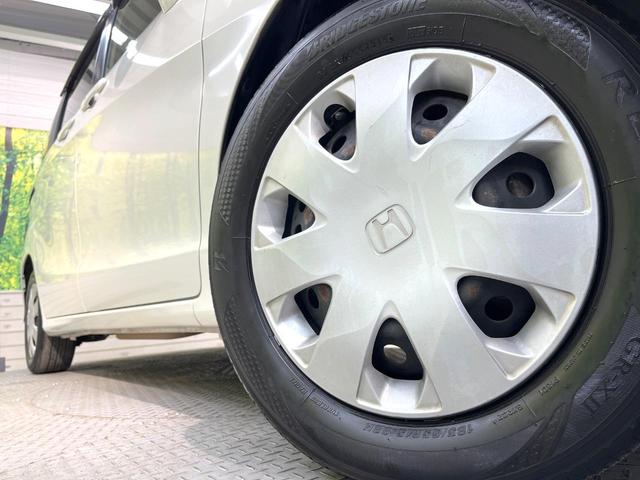 フリード Ｇ　ジャストセレクション　純正ナビ　電動スライドドア　バックカメラ　禁煙車　スマートキー　ＥＴＣ　オートエアコン　ＣＤ　ＤＶＤ再生　地デジ　電動格納ミラー　横滑り防止　プライバシーガラス　パワーウィンドウ　パワーステアリング（14枚目）