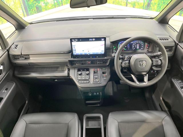 ステップワゴン e:HEVスパーダ 登録済未使用車 純正11.4型ナビ 両側電動ドア バックカメラ 衝突軽減装置 電動リアゲート ハーフレザーシート シートヒーター スマートキー LEDヘッド 純正16インチアルミ オートハイビーム(2枚目)