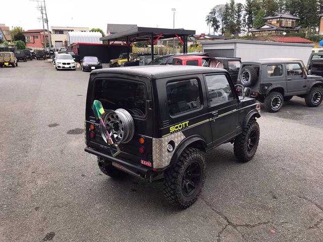 ジムニー スコットリミテッド AC PS 5MT 純正色 社外リーフリフトアップ 改造公認車 R3年小型貨物登録車 社外前後バンパーシシ狩りバンパー大 社外タンクガード 社外マフラー 社外ハンドル 社外AW MTタイヤ 社外ノブ(12枚目)