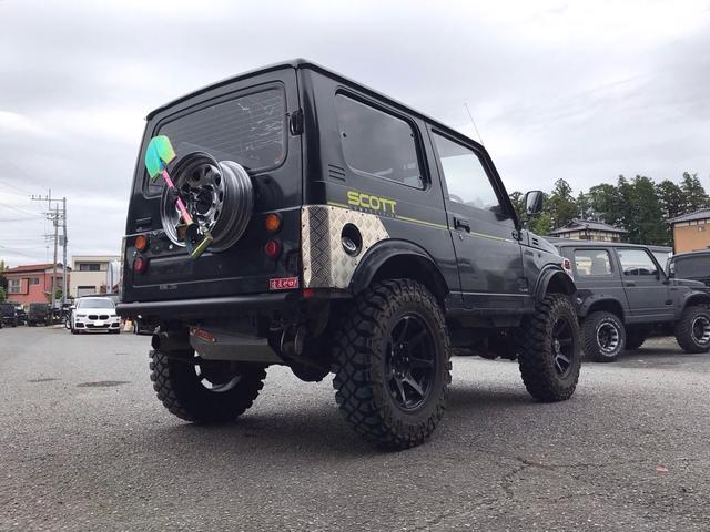 ジムニー スコットリミテッド AC PS 5MT 純正色 社外リーフリフトアップ 改造公認車 R3年小型貨物登録車 社外前後バンパーシシ狩りバンパー大 社外タンクガード 社外マフラー 社外ハンドル 社外AW MTタイヤ 社外ノブ(13枚目)