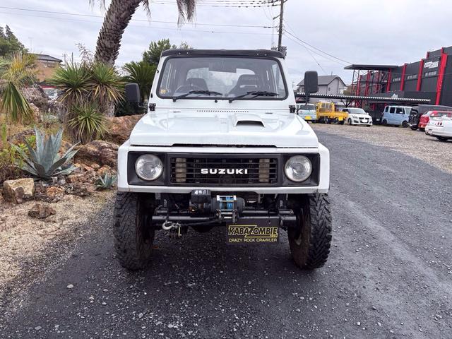 ジムニー CC AC PS 5MT 純正色 社外リーフリフトアップ JA22電動パワステ装着 BRIDEシートフルバケ 外ホイールMTタイヤ 外幌 1型グリル サイドシルガード 外追加メーター MOMOハン ウィンチ(2枚目)