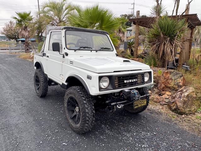 ジムニー CC AC PS 5MT 純正色 社外リーフリフトアップ JA22電動パワステ装着 BRIDEシートフルバケ 外ホイールMTタイヤ 外幌 1型グリル サイドシルガード 外追加メーター MOMOハン ウィンチ(5枚目)