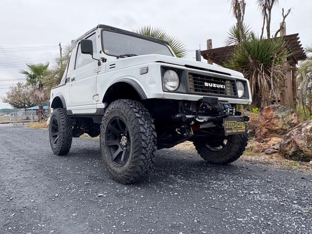 ジムニー CC AC PS 5MT 純正色 社外リーフリフトアップ JA22電動パワステ装着 BRIDEシートフルバケ 外ホイールMTタイヤ 外幌 1型グリル サイドシルガード 外追加メーター MOMOハン ウィンチ(7枚目)