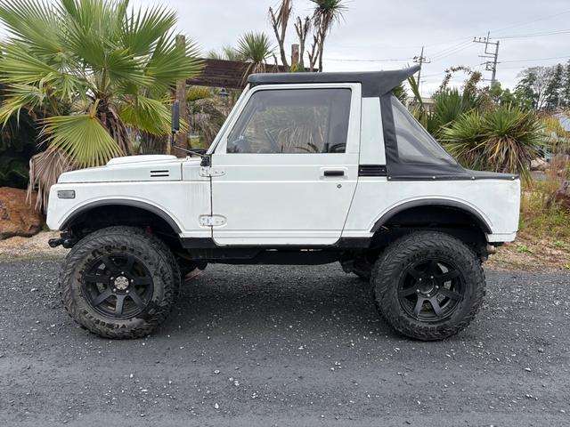 ジムニー CC AC PS 5MT 純正色 社外リーフリフトアップ JA22電動パワステ装着 BRIDEシートフルバケ 外ホイールMTタイヤ 外幌 1型グリル サイドシルガード 外追加メーター MOMOハン ウィンチ(16枚目)