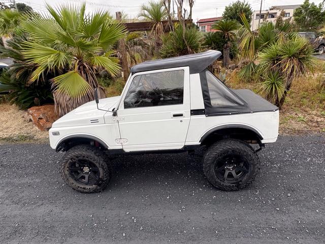 ジムニー CC AC PS 5MT 純正色 社外リーフリフトアップ JA22電動パワステ装着 BRIDEシートフルバケ 外ホイールMTタイヤ 外幌 1型グリル サイドシルガード 外追加メーター MOMOハン ウィンチ(17枚目)