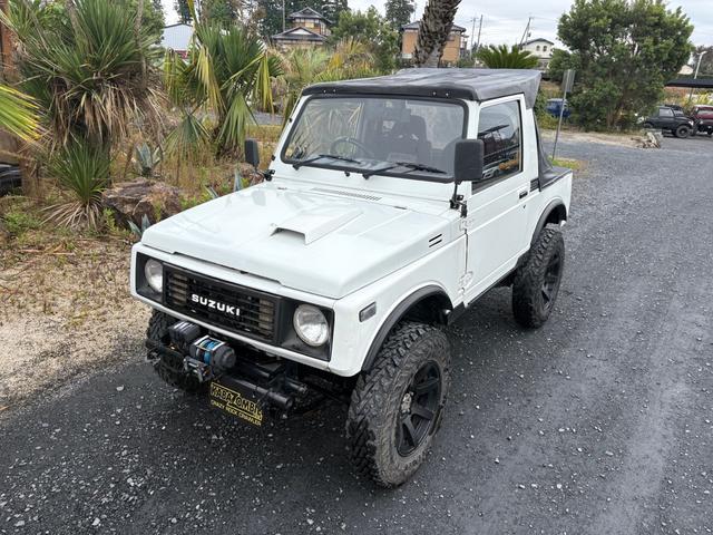 ジムニー CC AC PS 5MT 純正色 社外リーフリフトアップ JA22電動パワステ装着 BRIDEシートフルバケ 外ホイールMTタイヤ 外幌 1型グリル サイドシルガード 外追加メーター MOMOハン ウィンチ(20枚目)