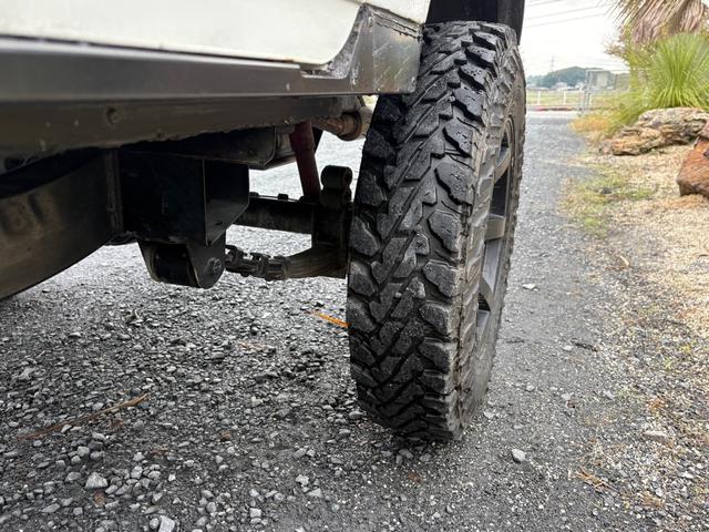 ジムニー CC AC PS 5MT 純正色 社外リーフリフトアップ JA22電動パワステ装着 BRIDEシートフルバケ 外ホイールMTタイヤ 外幌 1型グリル サイドシルガード 外追加メーター MOMOハン ウィンチ(33枚目)