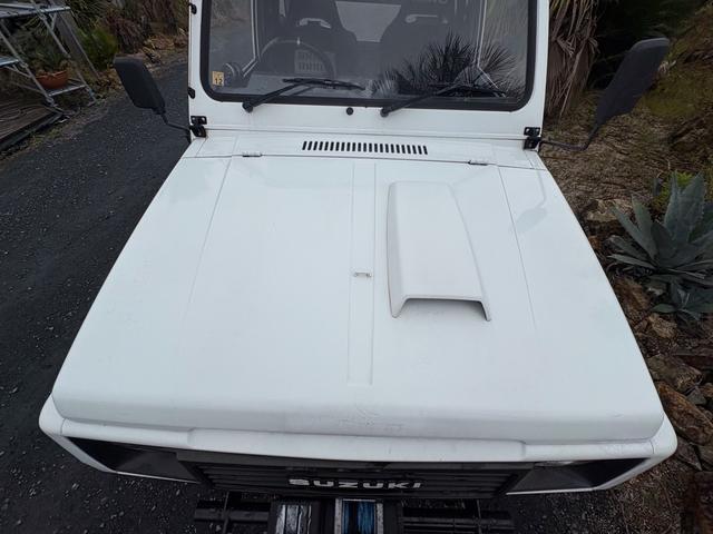 ジムニー CC AC PS 5MT 純正色 社外リーフリフトアップ JA22電動パワステ装着 BRIDEシートフルバケ 外ホイールMTタイヤ 外幌 1型グリル サイドシルガード 外追加メーター MOMOハン ウィンチ(55枚目)