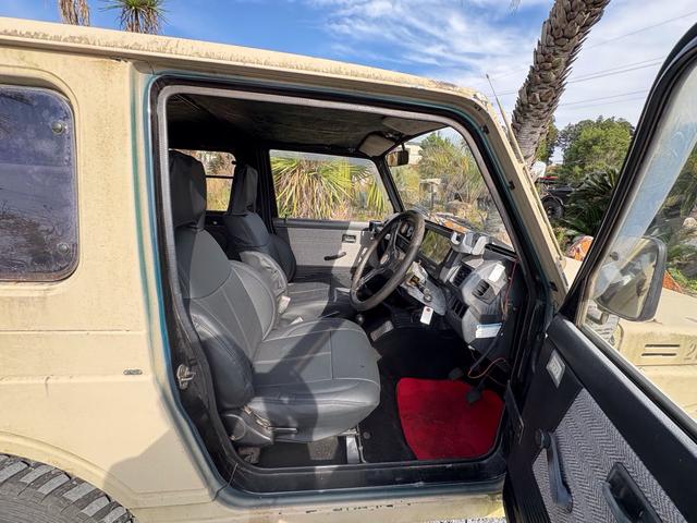 ジムニー スコットリミテッド AC PS 5MT 全塗装 社外フロントバンパー ワンオフ社外テールレンズ ナンバー灯移設 社外AW MTタイヤ 社外シートカバー 社外ハンドル 社外3連追加メーター オーディオレス(27枚目)