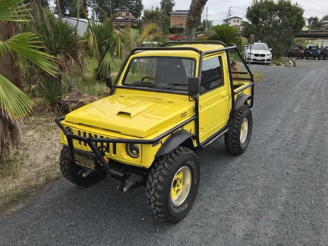 ジムニー サマーウインド　リミテッド　ＡＣ　ＰＳ　５ＭＴ　社外リーフリフトアップ　改造公認車　バンカット車　前後エアロッカー　ダウンギア　油圧電動Ｗパワステ　強化シャフト　ワンオフロールバー　２５５ＭＴタイヤ　ウィンチ　社外前後バンパー（6枚目）